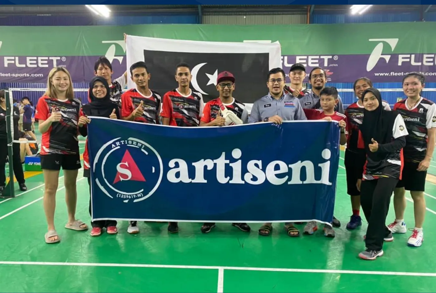 Team with an Artiseni event banner
